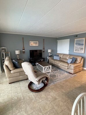 Living room with queen pull out bed. Newly updated paint and decor 2024