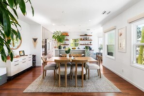 Gather, laugh, and savor—where open spaces meet warm embraces. This inviting kitchen and dining area is made for moments that matter.