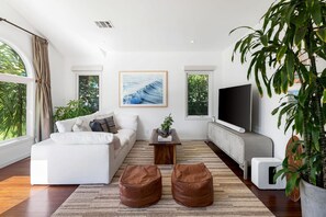 A cozy retreat where comfort meets style. Sink into the plush sofa, bask in natural light, and let the warmth of this inviting living space embrace you.