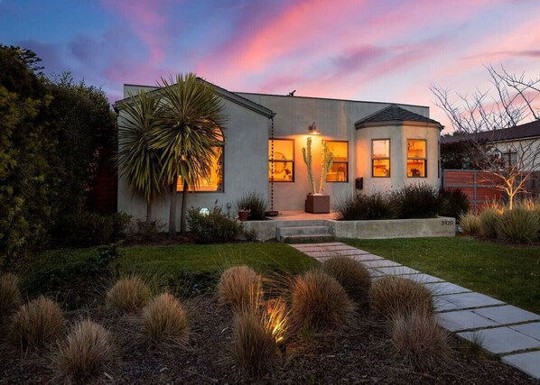 Where the golden glow of home meets the beauty of twilight—step inside and feel the warmth.