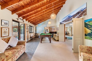 Living Room: Enjoy the thrill of pool and stunning mountain views in this open, inviting space!