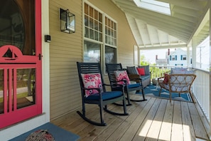 Spacious and cozy covered porch with plenty of sitting space