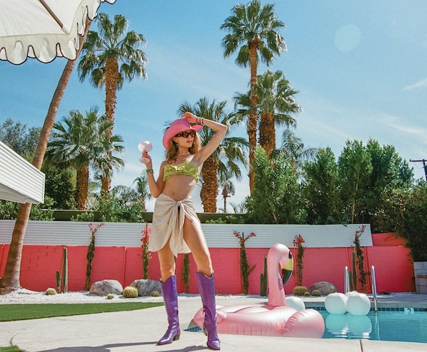 Poolside Paradise: Dive into fun with vibrant decor, palm views, and a refreshing vibe!