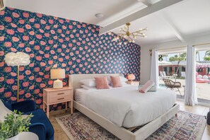 Charming Bedroom: Bright floral accents and inviting vibes lead you to the poolside paradise!