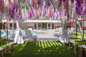 Unwind in this dreamy boutique retreat, featuring a lush, flower-adorned pergola, cozy swings, and a sparkling pool. With vibrant mid-century charm and resort-style relaxation, this hidden gem is perfect for a group getaway or a romantic escape.