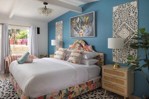 Escape to a designer-inspired retreat at The Muse Hotel! This stylish king suite features a plush bed, bold décor, and a private patio for the perfect Palm Springs getaway.