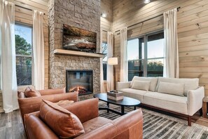 Relax by the fireplace with stunning views and inviting leather seating!