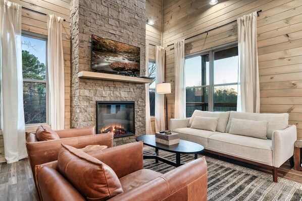 Relax by the fireplace with stunning views and inviting leather seating!