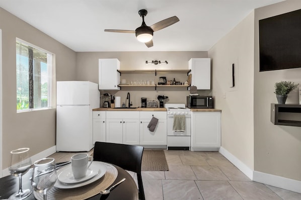 Modern Kitchen And Dining Space Perfect For Enjoying A Meal Or Hosting A Guest