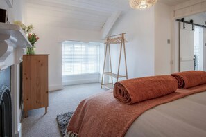 bedroom with king size bed looking towards the window