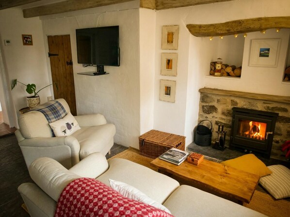 Sitting room woodburner and wall mounted TV