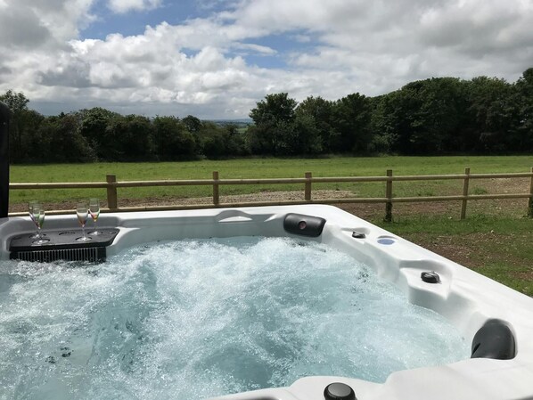 Hot tub with views over the wild flower meadow