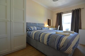 Double bedroom, wardrobe, bedside lamp, dressing table and chair