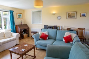 sitting area with two sofas and an arm chair