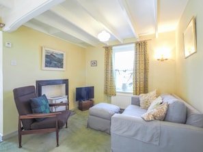 Sofa and footstall, armchair and TV