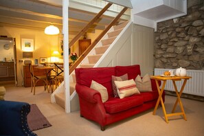 Living room with stairs to first floor