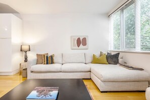 A large L-shaped sofa provides ample seating in the living area.