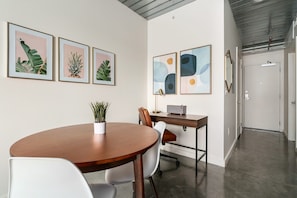 Work comfortably in the dedicated desk area with natural light.