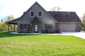 Big front yard with wrap-around lawn