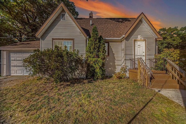 Front of home with attached garage.