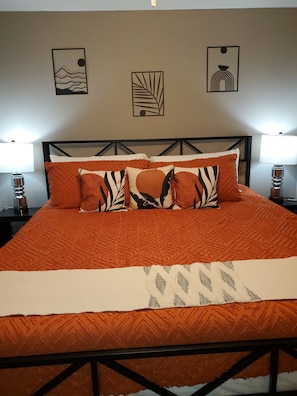 Master bedroom on 1st floor with king size bed. Equipped with bedside  charging stations, extra pillows and blankets.