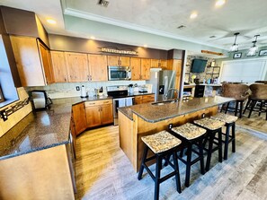 Fully equipped chef's kitchen with an island