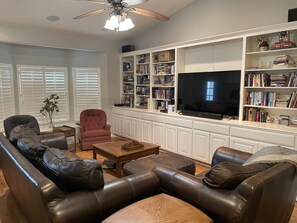 Family room with 60 in Smart TV.