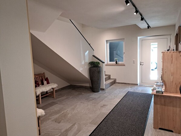 Building, Wood, Interior Design, Lighting, Floor, Flooring, Hall, Houseplant, Real Estate, Hardwood