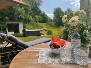Flower, Plant, Furniture, Property, Table, Cloud, Flowerpot, Bottle, Sky, Outdoor Furniture