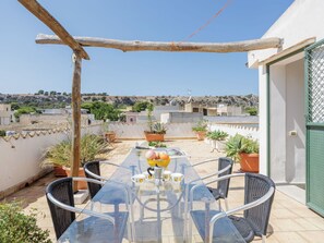 Plant, Sky, Building, Azure, Shade, Chair, Table, Flowerpot, Outdoor Furniture, Interior Design