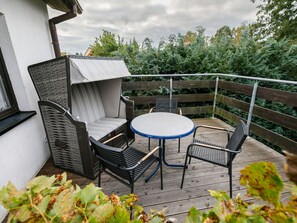 Plant, Furniture, Sky, Property, Cloud, Table, Outdoor Furniture, Chair, Shade, Building