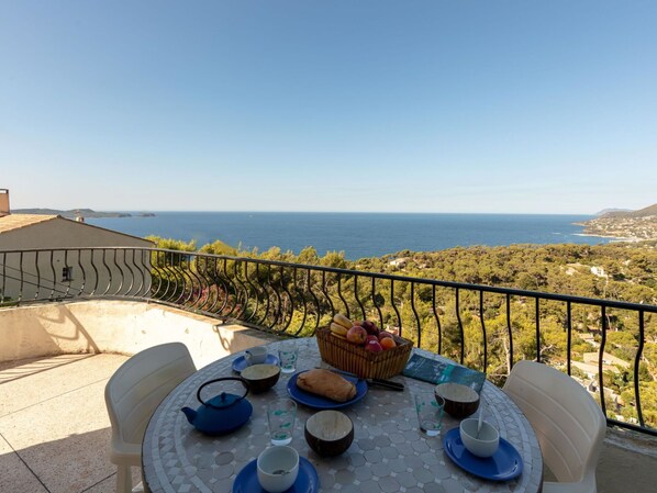 Sky, Water, Property, Tableware, Plant, Table, Building, Azure, Chair, Flowerpot