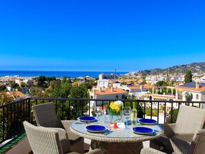 Sky, Table, Furniture, Building, Chair, Azure, Outdoor Furniture, Tree, Seaside Resort, Plant