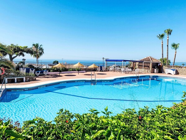Water, Sky, Plant, Swimming Pool, Azure, Tree, Outdoor Furniture, Seaside Resort, Shade, Leisure