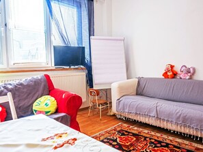 Furniture, Interior Design, Couch, Flooring, Floor, Textile, Room, Living Room, Apartment, Lighting