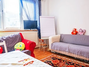 Furniture, Interior Design, Couch, Flooring, Floor, Textile, Room, Living Room, Apartment, Lighting