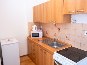 Furniture, Flooring, Wood, Kitchen Sink, Floor, Interior Design, Cabinetry, Kitchen, Room, Major Appliance