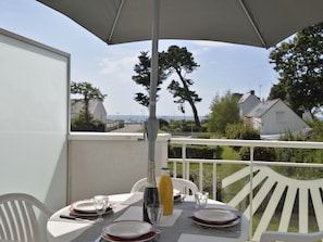 Table, Tableware, Furniture, Property, Sky, Chair, Umbrella, Plant, Plate, Building
