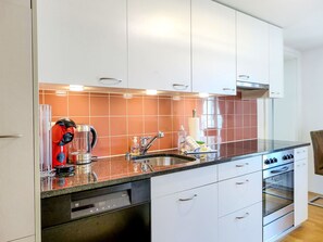 Cabinetry, Countertop, Tap, Building, Sink, Kitchen Appliance, Kitchen Stove, Kitchen, Drawer, Wood
