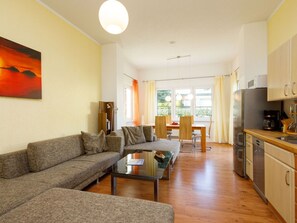 Furniture, Cabinetry, Property, Couch, Table, Interior Design, Orange, Floor, Drawer, Living Room