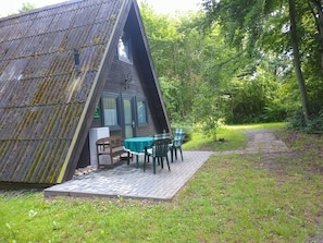 Plant, Tree, Shade, Table, Land Lot, Sky, Outdoor Furniture, Grass, Cottage, Natural Landscape