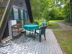 Plant, Property, Table, Tree, Chair, Road Surface, Shade, Outdoor Table, Outdoor Furniture, Window