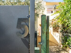Plant, Leaf, Building, Wood, Door, Tree, Road Surface, Facade, Real Estate, Gas