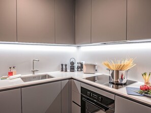 Kitchen Sink, Tap, Sink, Cabinetry, Property, Countertop, Plumbing Fixture, Kitchen, Interior Design, Lighting