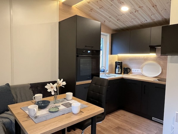 Furniture, Flower, Table, Cabinetry, Property, Couch, Countertop, Building, Interior Design, Comfort