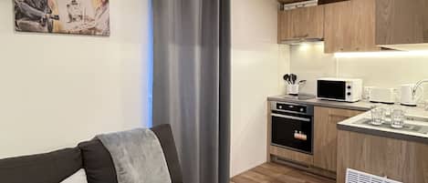 Property, Furniture, Cabinetry, Countertop, Comfort, Building, Interior Design, Lighting, Kitchen Stove, Wood
