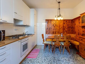 Cabinetry, Furniture, Countertop, Property, Wood, Kitchen Stove, Lighting, Interior Design, Kitchen, Flooring