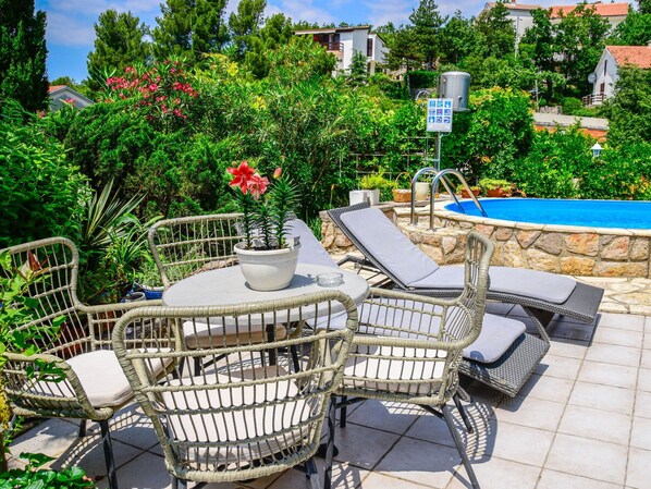 Furniture, Plant, Property, Table, Green, Sky, Chair, Flowerpot, Cloud, Flower