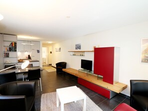 Property, Furniture, Picture Frame, Building, Comfort, Orange, Table, Flooring, Television, Floor