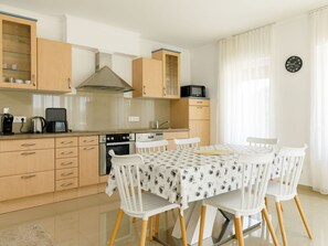 Cabinetry, Furniture, Property, Countertop, Wood, Kitchen, Chair, Drawer, Kitchen Stove, Interior Design